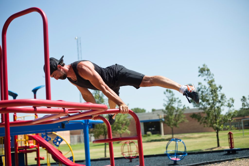 A man working out by balancing the weight of his body on his hands. Overcoming challenges could be strenuous but they lead to personal transformation.
