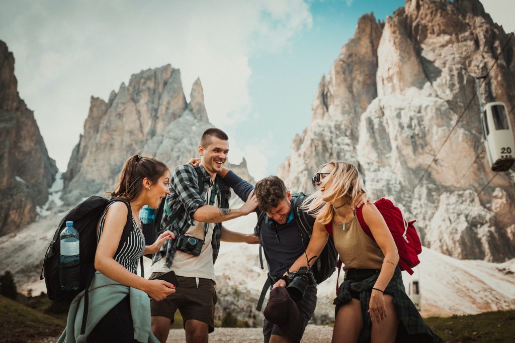 Photo by Felix Rostig on Unsplash. Meaningful travel team excited about new cultures.